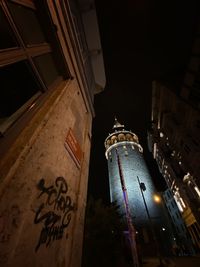 Low angle view of illuminated building at night