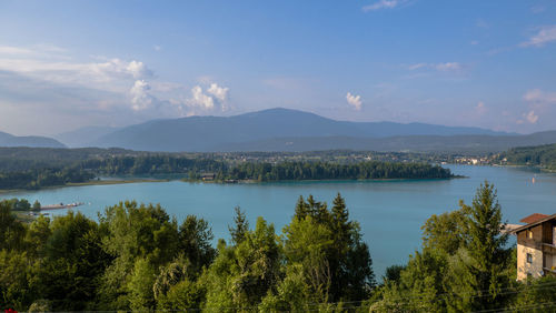 Scenic view of lake and mountains against sky