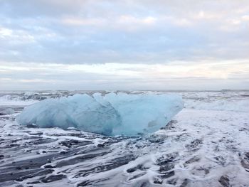 Scenic view of frozen sea against sky