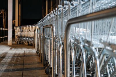 Shopping carts stacked outside a closed grocery store at night