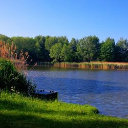 View of calm lake against clear sky