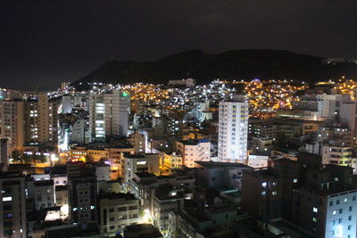 High angle view of illuminated buildings in city at night