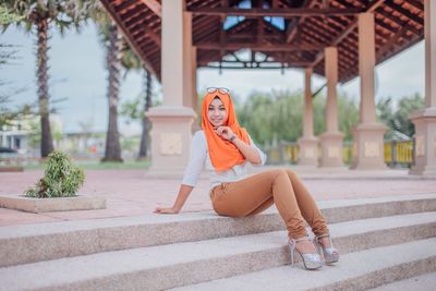 Close-up of girl sitting on steps outdoors