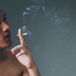 Close-up of man smoking cigarette