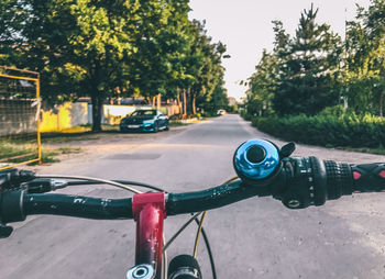 Close-up of bicycle parked on road