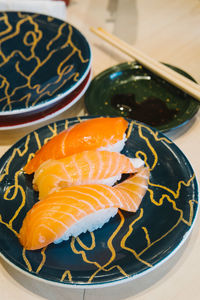 High angle view of fish in plate on table