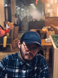 Midsection of man wearing hat