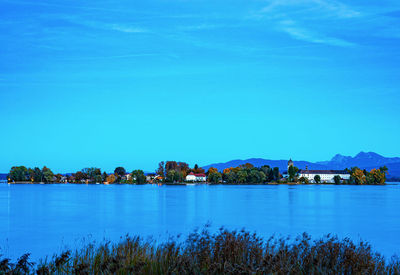 Scenic view of lake against blue sky