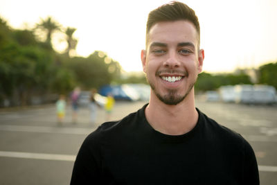 Portrait of young man standing outdoors