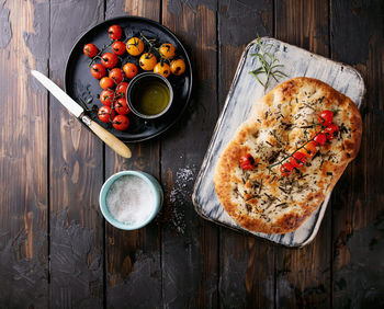 High angle view of pizza served on table