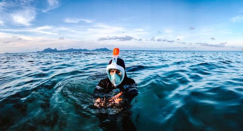 Portrait of man swimming in sea