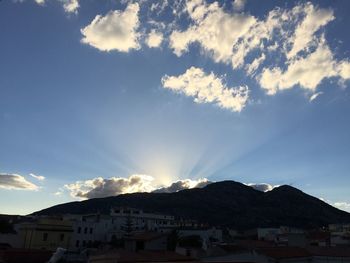 Scenic view of mountains against cloudy sky