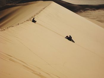 High angle view of people riding in desert