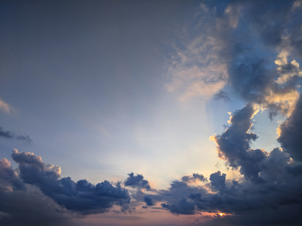 cloud - sky, sky, beauty in nature, low angle view, tranquility, scenics - nature, tranquil scene, sunset, no people, nature, outdoors, idyllic, cloudscape, day, dramatic sky, backgrounds, full frame, non-urban scene, sunlight, meteorology