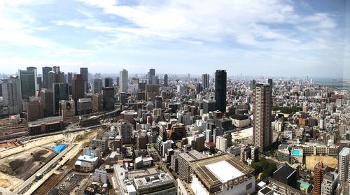 Aerial view of cityscape against sky