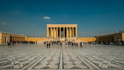 Group of people in front of historical building