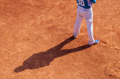 Low section of man standing on floor