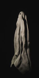 Close-up of human face against black background