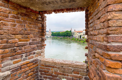 View of old building seen through window