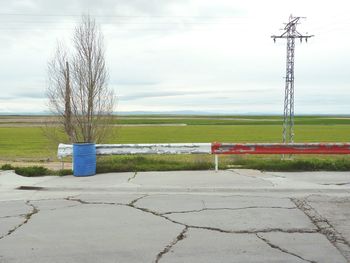 Scenic view of farm against sky