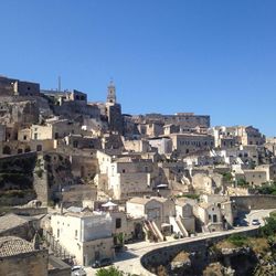 High angle shot of townscape against blue sky