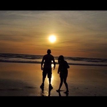 beach, sea, sunset, horizon over water, water, shore, leisure activity, sun, togetherness, lifestyles, sky, silhouette, sand, orange color, men, beauty in nature, vacations, scenics