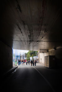 People walking in tunnel