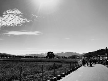 High angle view of people on landscape against sky