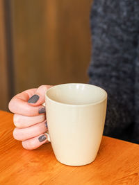 Close-up of coffee cup on table