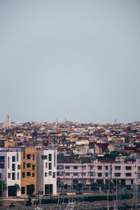 Exterior of buildings in city against clear sky