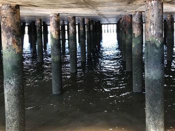 Reflection of pier on sea