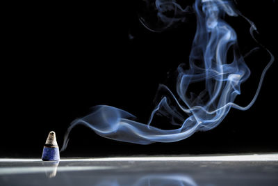 Close-up of smoke against black background