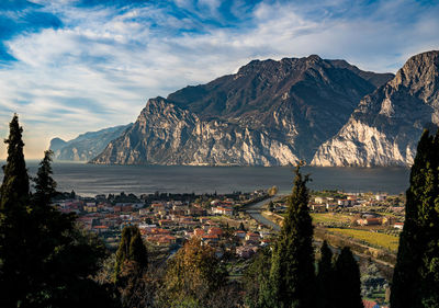 Panoramic view of townscape and mountains against sky