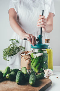 Midsection of man preparing food on table