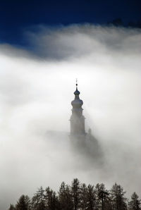 Low angle view of historical building against cloudy sky