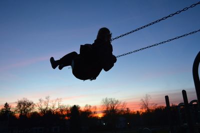 Silhouette of people at sunset