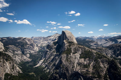 Scenic view of mountains against blue sky