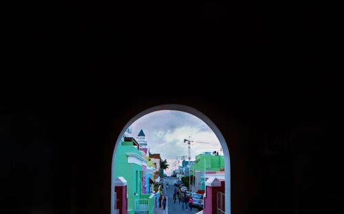 People seen through archway