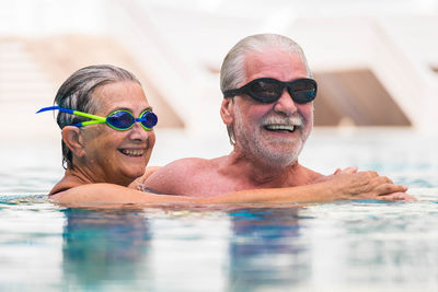 Portrait of smiling man in swimming pool
