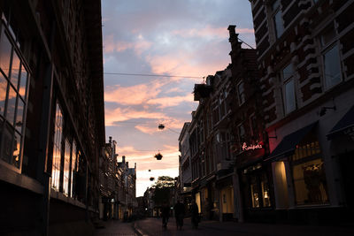 Low angle view of buildings at sunset