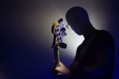 Close-up of person against gray background