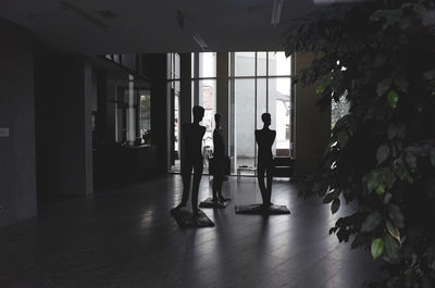 People in corridor of building