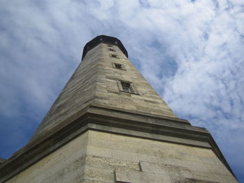 Low angle view of historical building against cloudy sky