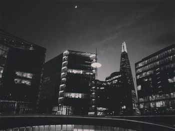 Low angle view of skyscrapers lit up at night