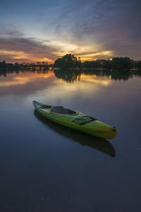 Scenic view of calm lake at sunset