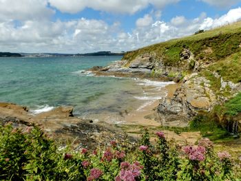 Scenic view of sea and coastline against sky