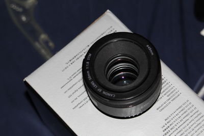 Close-up of camera on book
