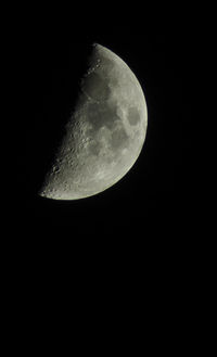 Low angle view of moon against sky at night