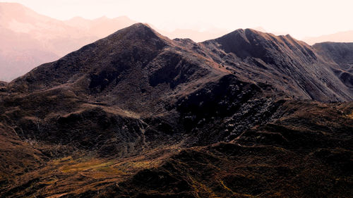 Aerial view of mountain range against sky