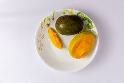 High angle view of fruits in plate on table